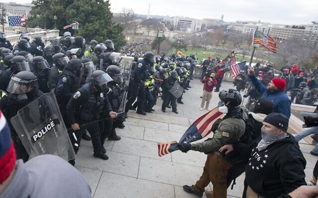 US Capitol Police push back demonstrators who were trying to enter the US Capitol on January 6, 2021, in Washington. (AP Photo/Jose Luis Magana)