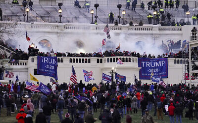Violent protesters, loyal to US President Donald Trump, storm the Capitol on January 6, 2021, in Washington. (AP/ John Minchillo)