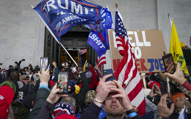 Trump supporters gather outside the US Capitol in Washington, January 6, 2021. (AP Photo/John Minchillo, File)
