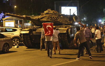 In this July 16, 2016 photo, tanks, part of the forces that attempted a coup, move into position as people attempt to stop them, in Ankara, Turkey. (AP Photo/File)