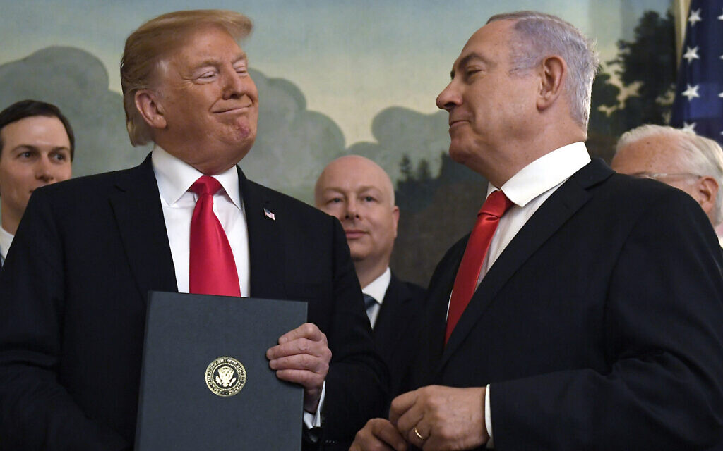 In this March 25, 2019, photo, then-US president Donald Trump (left) smiles at Prime Minister Benjamin Netanyahu after signing a proclamation recognizing the Golan Heights as part of Israel, in the Diplomatic Reception Room at the White House in Washington. (AP Photo/Susan Walsh)
