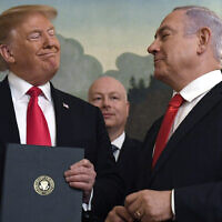 In this March 25, 2019, photo, then-US president Donald Trump (left) smiles at Prime Minister Benjamin Netanyahu after signing a proclamation recognizing the Golan Heights as part of Israel, in the Diplomatic Reception Room at the White House in Washington. (AP Photo/Susan Walsh)