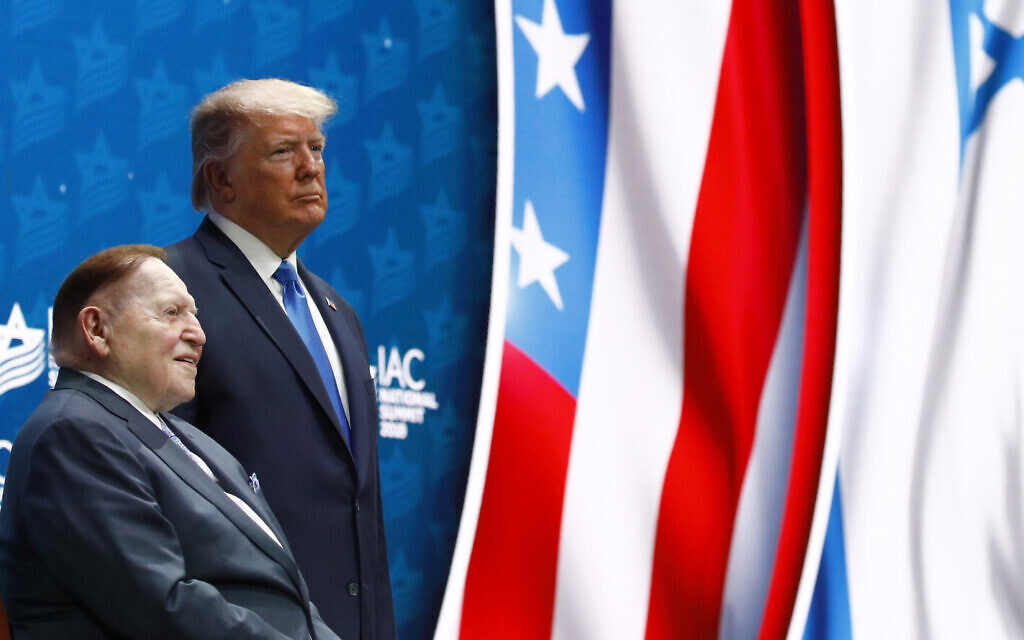 US President Donald Trump alongside Las Vegas Sands Corporation Chief Executive and Republican mega donor Sheldon Adelson before speaking at the Israeli American Council National Summit in Hollywood, Florida, December 7, 2019. (AP Photo/Patrick Semansky)