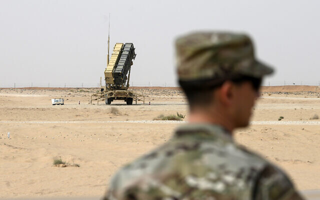 A member of the US Air Force stands near a Patriot missile battery at the Prince Sultan air base in al-Kharj, central Saudi Arabia, February 20, 2020 (Andrew Caballero-Reynolds/Pool via AP)