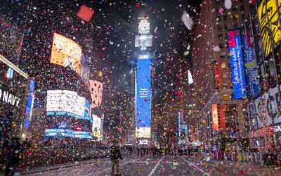 Confetti flies after the Times Square New Year's Eve Ball drops in a nearly empty Times Square, early Friday, Jan. 1, 2021, as the area normally packed with revelers remained closed off due to the ongoing coronavirus pandemic. (AP Photo/Craig Ruttle)