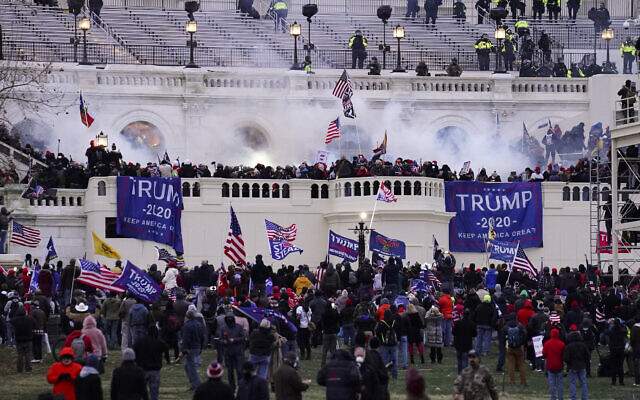 Violent protesters, loyal to US President Donald Trump, storm the Capitol, January 6, 2021, in Washington. (AP Photo/John Minchillo)