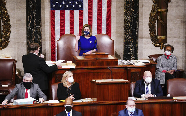 Speaker of the House Nancy Pelosi speaks in the House Chamber after they reconvened for arguments over the objection of certifying Arizona’s Electoral College votes in November’s election, at the Capitol in Washington, Wednesday, Jan. 6, 2021. (Jim Lo Scalzo/Pool via AP)