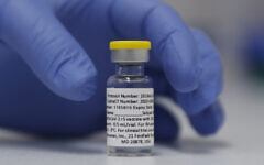 A vial of the Phase 3 Novavax coronavirus vaccine is seen ready for use in the trial at St. George's University hospital in London Wednesday, Oct. 7, 2020 (AP Photo/Alastair Grant)