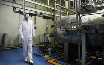 An Iranian technician walks through the Uranium Conversion Facility just outside the city of Isfahan 255 miles (410 kilometers) south of the capital Tehran, Iran, February 3, 2007. (Vahid Salemi/AP)