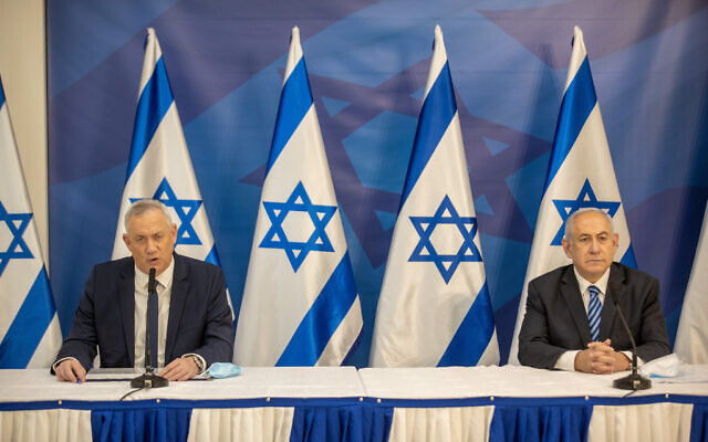 Prime Minister Benjamin Netanyahu, right, and Defense Minister Benny Gantz hold a press conference in Tel Aviv on July 27, 2020. (Tal Shahar/Pool/Flash90)