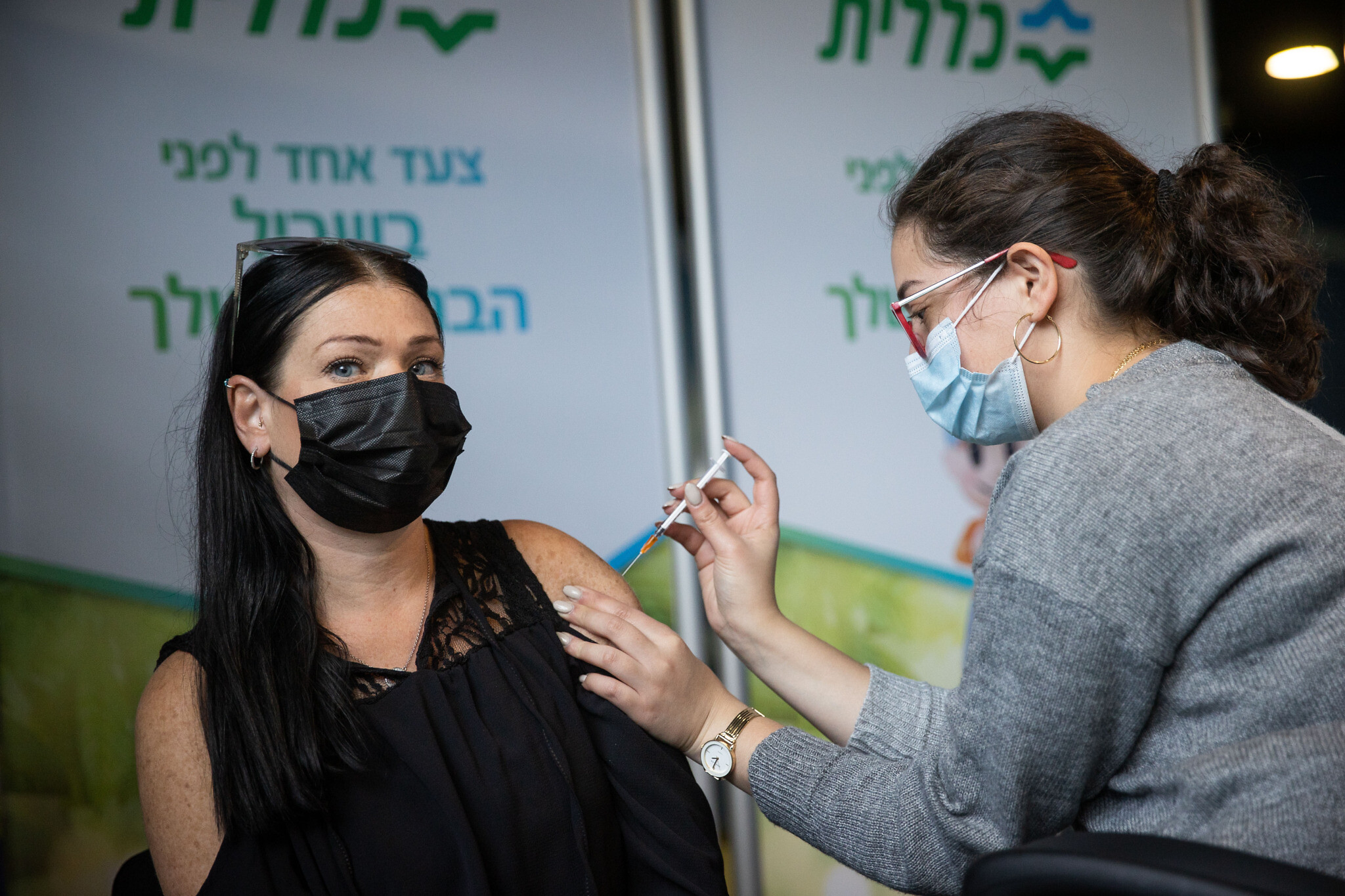 An education worker receives a COVID-19 vaccine injection, at a Clalit clinic in Jerusalem, January 12, 2021. (Yonatan Sindel/Flash90)