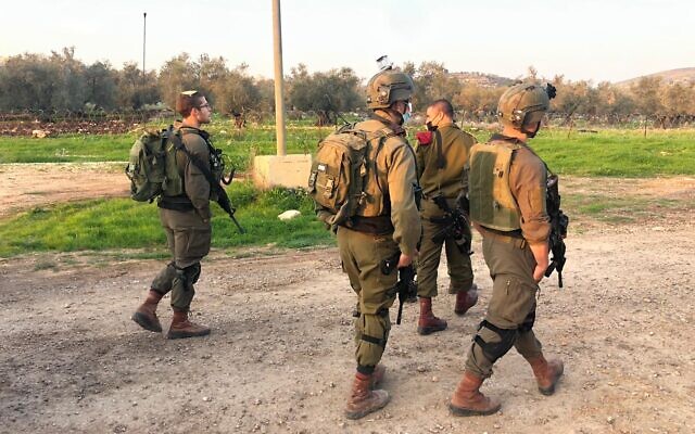 A photo released by the Israel Defense Forces shows soldiers in the West Bank following an attempted ramming and stabbing attack near the Palestinian town of Yabad on January 9, 2021. (Israel Defense Forces)