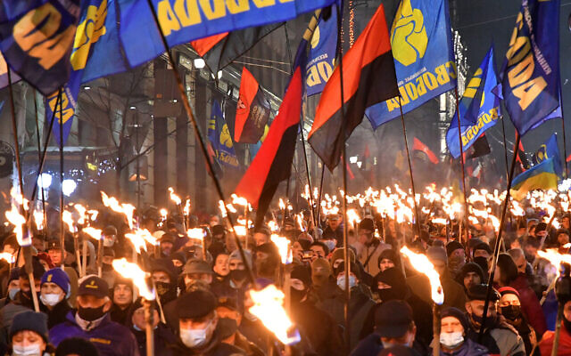 Participants of an annual event in honor of Stepan Bandera march through Kyiv, Ukraine on Jan. 1, 2021. (Genya Savilou/AFP)