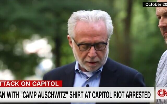 Wolf Blitzer says Kaddish at Auschwitz during a 2014 visit for a documentary. (Screenshot)