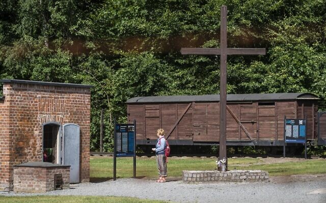 In this file photo taken on July 21, 2020 a woman is seen next to a gas chamber at the museum of the former Nazi Death Camp Stutthof, in Sztutowo, July 21, 2020. (Wojtek RADWANSKI / AFP)
