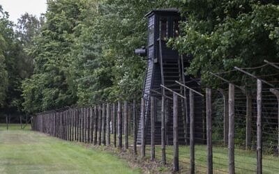 Barbed wire fence and a watch tower are seen at the former Nazi Death Camp Stutthof, in Sztutowo, July 21, 2020. (Wojtek RADWANSKI / AFP)