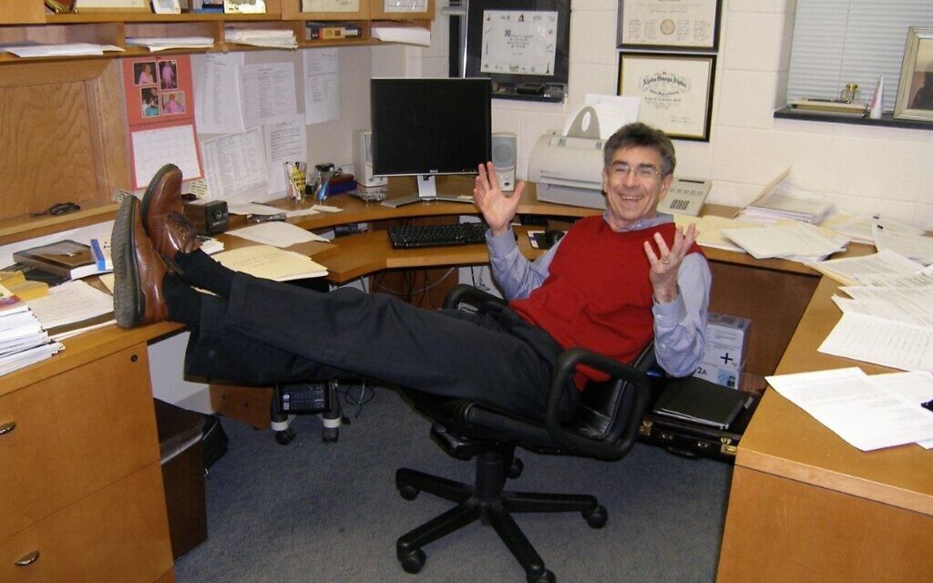This photo of Dr. Robert Lefkowitz in his office at Duke University captures a pose that all of his trainees will undoubtedly find familiar: feet up on the desk, smile on his face, exulting over the latest data. (Courtesy)