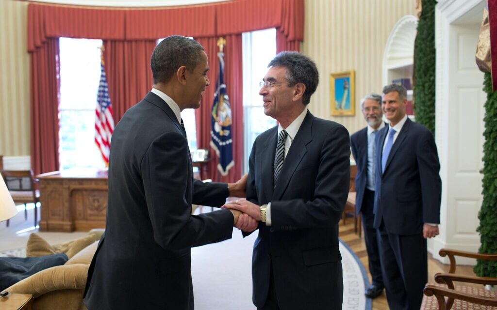 Dr. Robert Lefkowitz shakes hands with former president Barack Obama in 2012 prior to departing to Sweden to accept the Nobel Prize. (Courtesy)