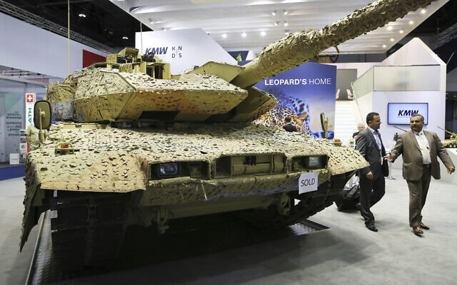 Illustrative: Men walk past a Krauss-Maffei Wegmann Leopard tank with a "sold" sign on it at the International Defense Exhibition and Conference, known by the acronym IDEX, in Abu Dhabi, United Arab Emirates, February 22, 2017 (AP Photo/Jon Gambrell, File)