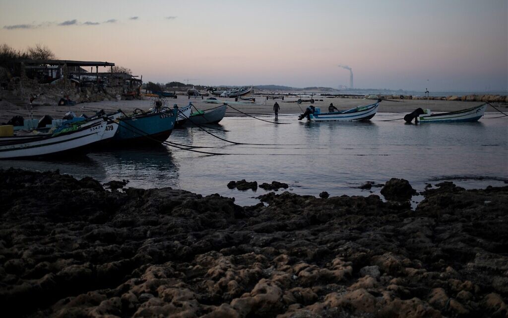 Fishermen unload their nets after returning from a fishing trip on the Mediterranean Sea, in the Israeli Arab village of Jisr az-Zarqa, in the early morning of Thursday, Feb. 25, 2021 (AP Photo/Ariel Schalit)