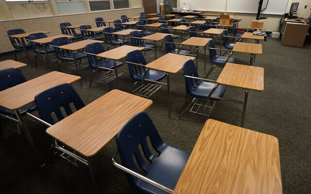 Illustrative: Empty desks at a junior high school in California, October 6, 2020. (AP Photo/Gregory Bull, File)