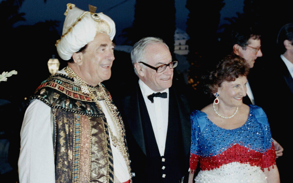 Newspaper magnate, Robert Maxwell, dressed in traditional Moroccan costume and his wife with Malcolm Forbes at his Mendoub Palace in Tangiers, Morocco, Saturday, August 20, 1989. (AP Photo)