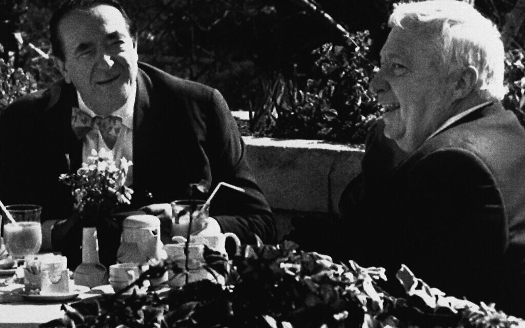 Immediately after resigning as Industry Minister, then-MK Ariel Sharon (right), meets with British millionaire Robert Maxwell (left) in Jerusalem on Tuesday, February 20, 1990. (AP Photo)