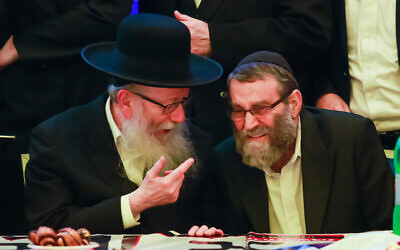 United Torah Judaism party chairman and Health Minister Yaakov Litzman (L) and party member Moshe Gafni attend the party headquarters on election night in Giv'at Shmuel, March 2, 2020. (Roy Alima/ Flash90)