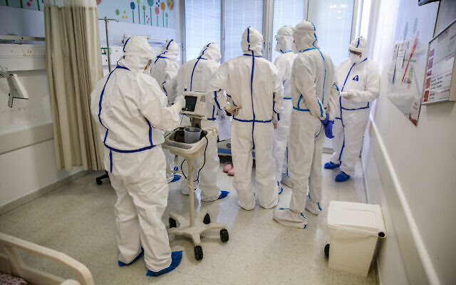 Illustrative: Medical staff in the coronavirus ward of Ziv Medical Center in the northern Israeli city of Safed, on February 4, 2021. (David Cohen/Flash90)