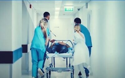Illustrative image of medics treating a patient (YouTube screenshot)