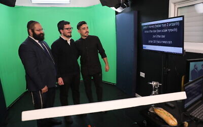 Rabbi Yehoshua Soudakoff (left) in the green screen room with actors Daniel Malka (center) and Chen Belilty. (Courtesy)