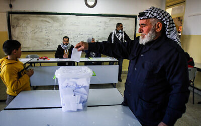 A Palestinian man casts a ballot during elections for the Fatah movment in the Nablus area, on the outskirts of the West Bank city of Nablus, January 23, 2021. (Nasser Ishtayeh/Flash90)
