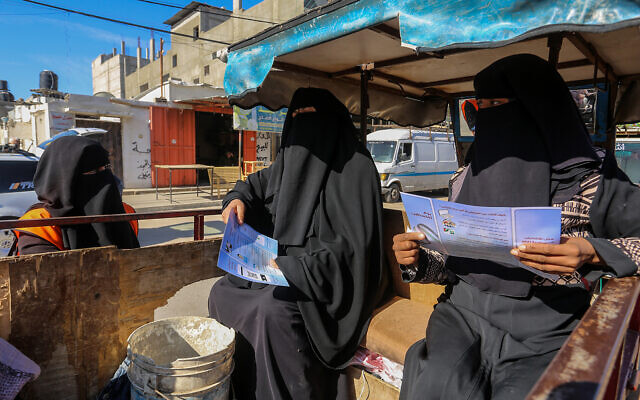 Palestinian Central Election Commission workers register citizens in preparation for elections, in Rafah, in the southern Gaza Strip, on February 10, 2021. (Abed Rahim Khatib/Flash90)