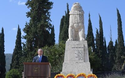 Prime Minsiter Benjamin Netanyahu gives a speech at a memorial ceremony in Tel Hai on February 23, 2021. (Amos Ben Gershom/GPO)