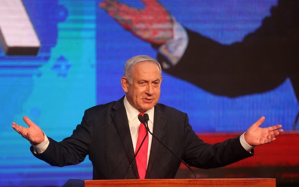 Prime Minister Benjamin Netanyahu, leader of the Likud party, addresses supporters at the party’s election night event in Jerusalem, early on March 24, 2021. (Emmanuel Dunand/AFP)
