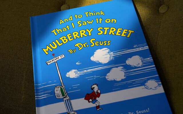 A copy of the book "And to Think That I Saw It on Mulberry Street," by Dr. Seuss, March 1, 2021, in Walpole, Massachusetts (AP Photo/Steven Senne)