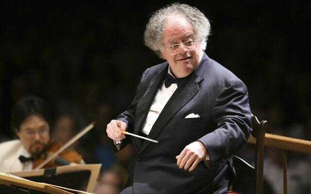 FILE: James Levine conducts the Boston Symphony Orchestra on its opening night performance at Tanglewood in Lenox, Mass. on July 7, 2006. Levine, who ruled over the Metropolitan Opera for 4 1/2 decades before being eased out when his health declined and then fired for sexual improprieties, died March 9, 2021 in Palm Springs, Calif., of natural causes, his physician of 17 years, Dr. Len Horovitz, said Wednesday, March 17. He was 77. (AP Photo/Michael Dwyer, File)