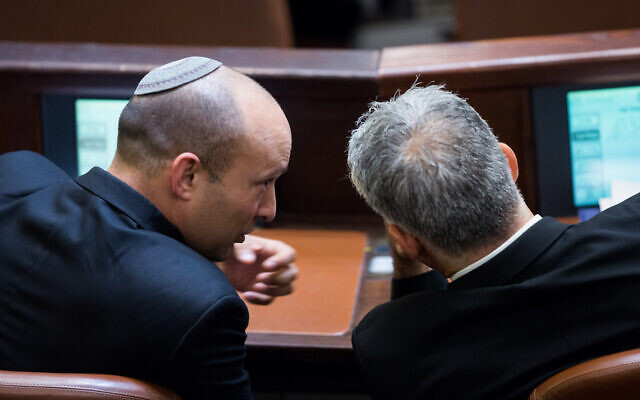 Then-education minister Naftali Bennett (L) with Yesh Atid leader Yair Lapid in the Knesset on September 2, 2015. (Yonatan Sindel/Flash90)