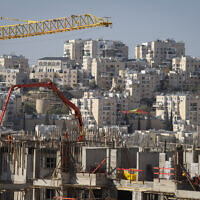 Construction work for new housing in the West Bank settlement of Modi'in Illit, on January 11, 2021. (Flash90)