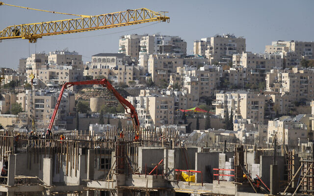 Construction work for new housing in the West Bank settlement of Modi'in Illit, on January 11, 2021. (Flash90)