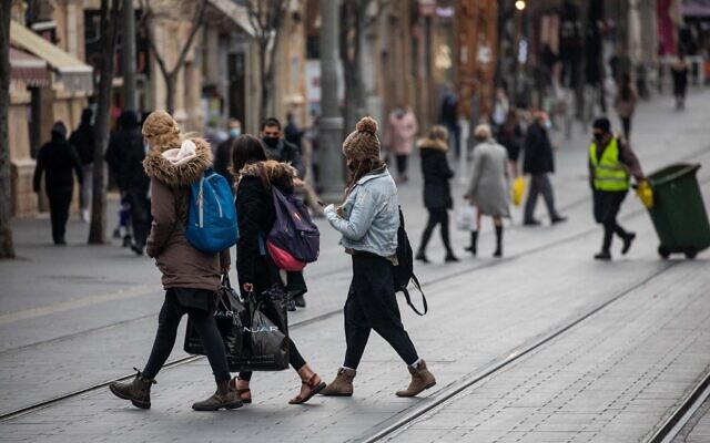 People walk on Jaffa street in downtown Jerusalem on March 1, 2021. (Yonatan Sindel/Flash90)