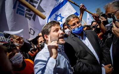 Religious Zionism party leader Bezalel Smotrich, left, and Itamar Ben Gvir of the far-right Otzma Yehudit party at an election campaign tour at the Mahane Yehuda market in Jerusalem on March 19, 2021(Yonatan Sindel/Flash90)