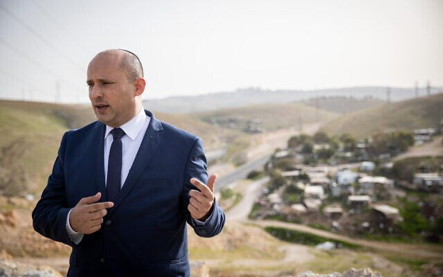 Yamina party leader Naftali Bennett at a conference of the Srugim news site above the West Bank Bedouin village Khan al-Ahmar, on March 21, 2021. (Yonatan Sindel/Flash90)