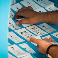 Voting slips for Knesset elections on March 23, 2021. (Avi Roccah/Flash90)
