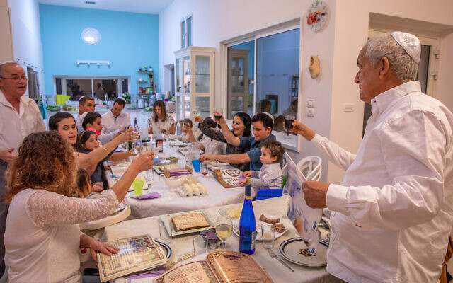 Illustrative photo of an Israeli family celebrating the Passover holiday in Moshav Yashresh on March 27, 2021. (Yossi Aloni/Flash90)