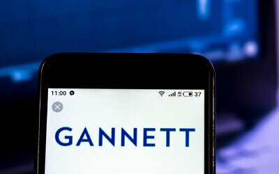 Gannett Media company logo seen displayed on a smart phone. (Igor Golovniov/SOPA Images/LightRocket/Getty Images via JTA)