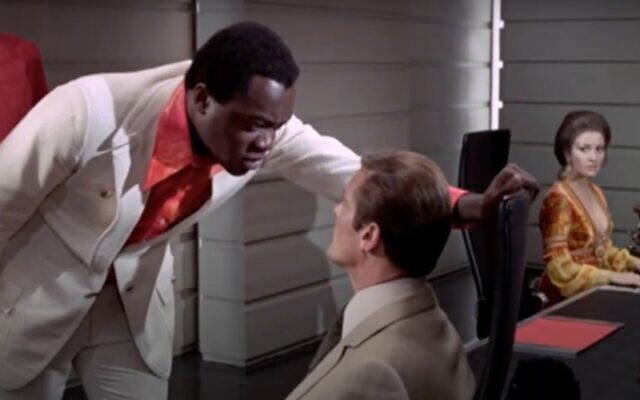 Screen capture from video of actor Yaphet Kotto, left, with Roger Moore in the film 'Live and Let Die.' (YouTube)