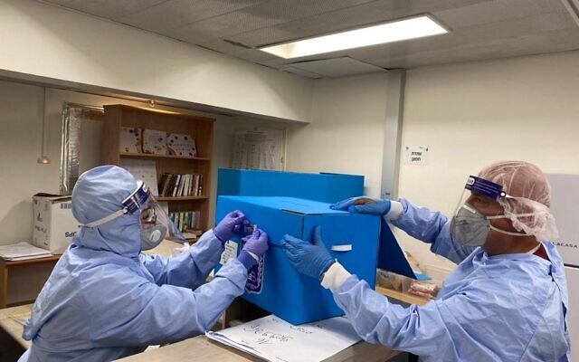 Officials prepare a polling station for COVID-19 patents at Rambam Medical Center in Haifa for the March 2021 election (courtesy of Rambam Medical Center)