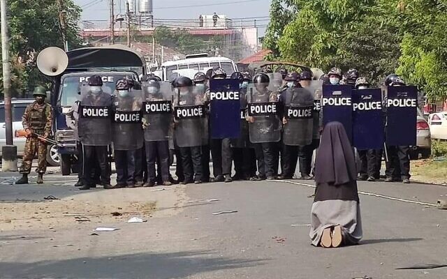A nun in Myanmar pleads with police not to open fire on protesters (Myitkyiana News Journal)