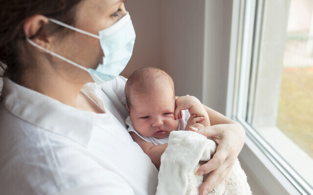 A baby, born during the pandemic, with the mother (vlada_maestro via iStock by Getty Images)